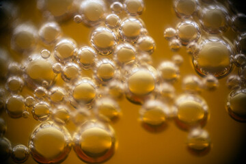 a lot of beer bubbles on the walls of the glass	
