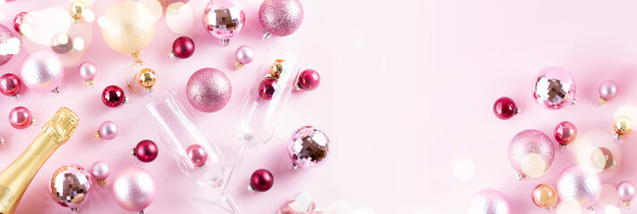 Christmas party with champagne on pink background banner, copy space