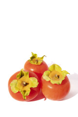 Persimmon.
Ripes orange persimmon fruit isolated on white background.Close up of fresh kaki on white.Set of kaki.