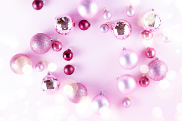 Christmas decoration balls frame on pink background