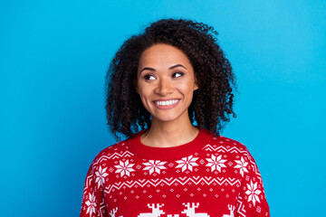 Portrait of charming young lady wear red ugly xmas sweater looking smiling empty space black friday gifts isolated on blue color background