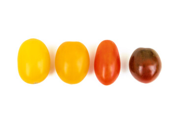 Different sorts of tomatoes isolated on white background.
Fresh, ripe type of small and round...