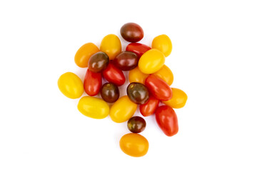 Different sorts of tomatoes isolated on white background.
Fresh, ripe type of small and round cocktail tomatoes, of red, yellow and orange color. Solanum lycopersicum var. cerasiforme. 