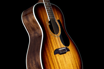 Mahogany Acoustic Guitar Isolated Upright on a Black Backgound