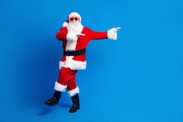 Fototapeta na wymiar Full size photo of pensioner senior man dancing discotheque dressed stylish santa claus costume coat isolated on blue color background