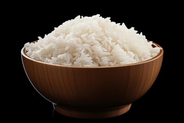 A wooden bowl filled with white rice on a black background. This versatile image can be used to depict various concepts such as healthy eating, Asian cuisine, food preparation, and simplicity.