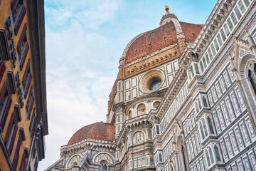 Detail of the Florence cathedral Santa Maria del Fiore at dawn on a day with blue sky