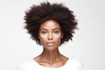 A woman with an afro hairstyle and eyeliners on her face. Perfect for beauty and fashion-related projects