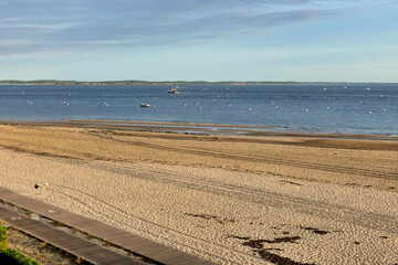 Evening on the shoreline at Arcachon looking across the Arcachon Bay towards the shoreline of Cap...