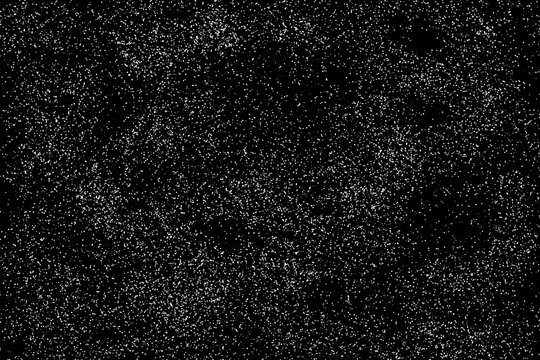 Black background with detailed white particles.