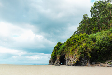 Fototapeta premium Asturias beach with a cliff and forest