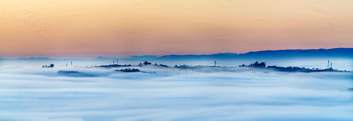 Sunrise, sunset over cloud inversion in sea of clouds, 