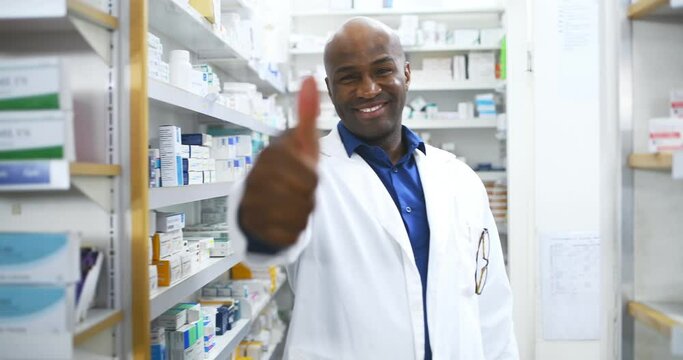 Happy black man, pharmacist and thumbs up for pharmaceutical success in healthcare. Portrait of African male person, doctor or medical professional showing like emoji, yes sign or OK at pharmacy - Powered by Adobe
