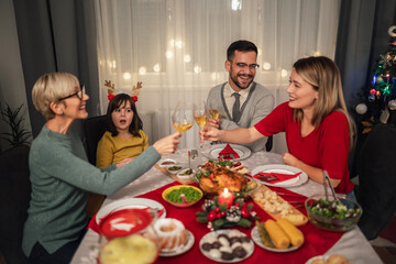 Happy multi-generation family enjoying in a lunch together at home. Family on Christmas dinner at home