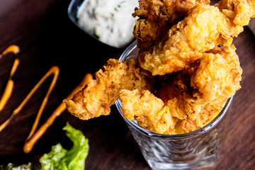 close upshot of food including pizza,chicken leg piece, chowmein noodels and non veg dishes