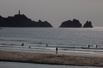 Fototapeta na wymiar Backlit view of the Cavo Vilan lighthouse from Balea beach in Camariñas. Costa da Morte, Galicia