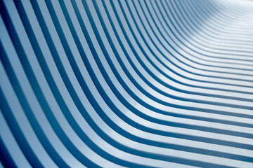 Blue pattern of a wooden bench with curved geometry, vertical slats