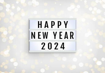 Happy New Year lightbox on lights blur bokeh white background. Light box with inscription Happy New...