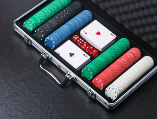 the aluminium suitcase with poker set, top view, copy space - 674866480