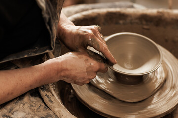 hands of a potter at work