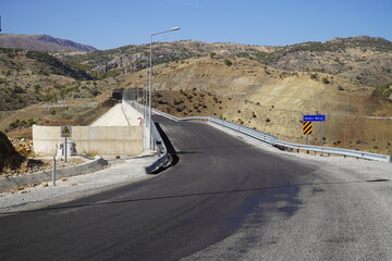 Road above the dam for the hydroelectric power plant, Bozkir Baraji Dam, Zafer Aksaray, Central...
