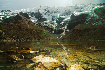 laguna humantay with snow covered mountains in the background