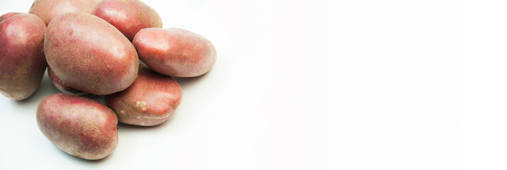 potatoes on a white background. good harvest concept. ripe potatoes on a light texture	