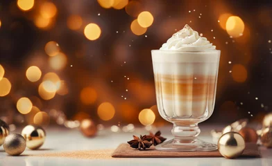 Fotobehang Stemmed glass of Eggnog Latte cocktail with whipped cream on blurred festive background. Winter holidays concept. Horizontal, side view. © Iryna