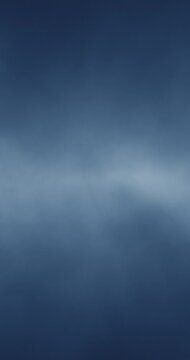 Abstract bright blue cloud of smoke loop vertical background.