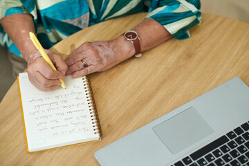 Senior woman working on cover letter before applying for job