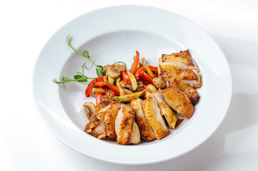 baked duck with vegetables in a plate on a white background