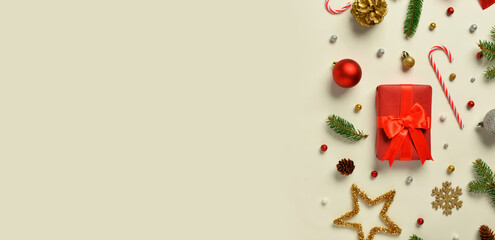 Christmas gift and decorations on beige background with space for text, top view