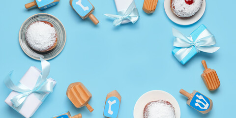 Composition for Hanukkah celebration on light blue background with space for text, top view