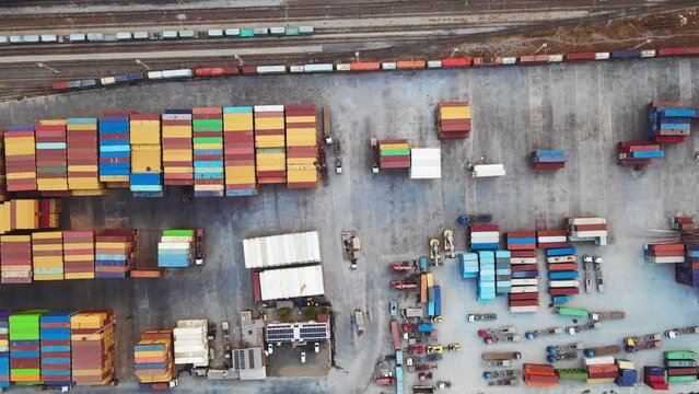 Aerial top down view of container terminal intermodal with shipping containers. export import of global international trade