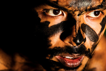 portrait of a person with painted face trying to get out and get freedom 