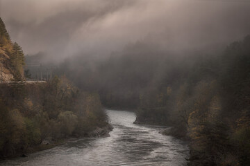Low clouds and mist slowly flowed along the Rioni gorge