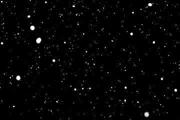 Testura of falling snow on a black background