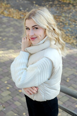 Portrait of a young beautiful blonde with long hair