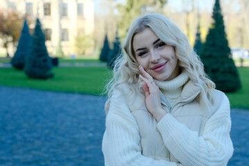 Portrait of a young beautiful blonde with long hair