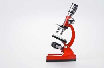Red Microscope on Grey Background