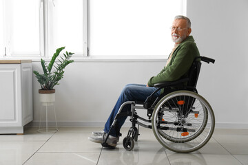 Senior man in wheelchair at home