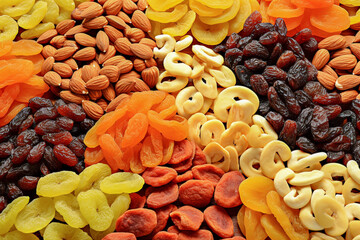 Background of delicious dried fruits and nuts - obrazy, fototapety, plakaty