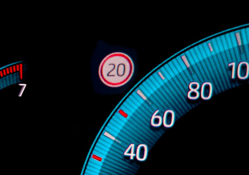 Speed limit warning close to speedometer indicator