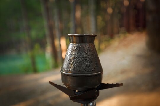 &ETH;&bull;urkish coffee in turk cup on forest background