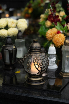 Lanterns and flowers on the grave on All Saints' Day