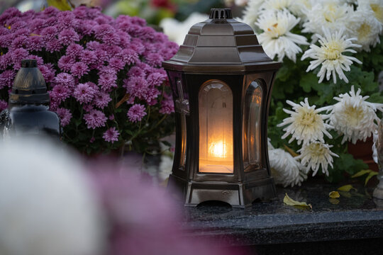 Lantern and chrysanthemum on the grave on All Saints' Day