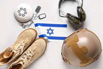 Flag of Israel with military ammunition and Jewish hat on white background