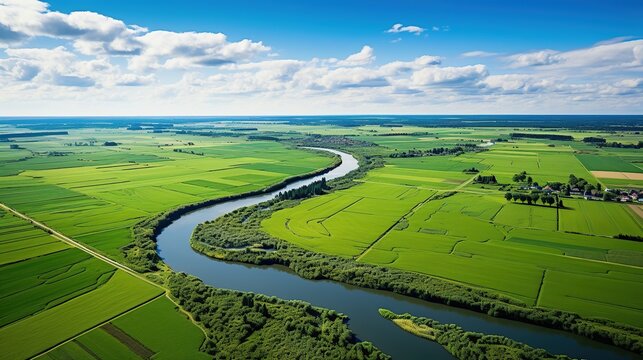 Aerial drone view of typical Dutch landscape with canals, polder water, green fields and farm houses from above, Holland, Netherlands