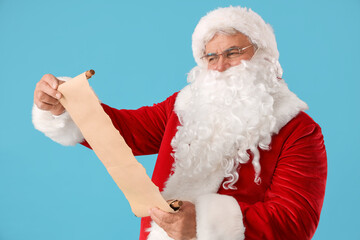 Santa Claus reading wish list on blue background