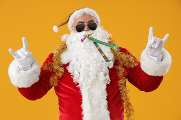 Cool Santa Claus with party blowers showing 